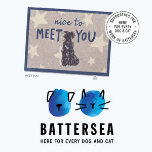 Promotional image for the Meet You Hug Rug washable doormat supporting Battersea charity
