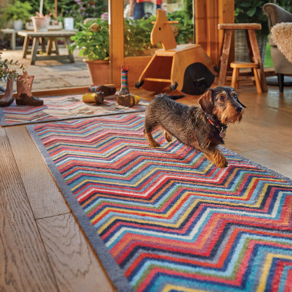 Chevron 1 Multicoloured Runner- a 100% recycled cotton runner featuring multicoloured chevrons arranged horizontally.