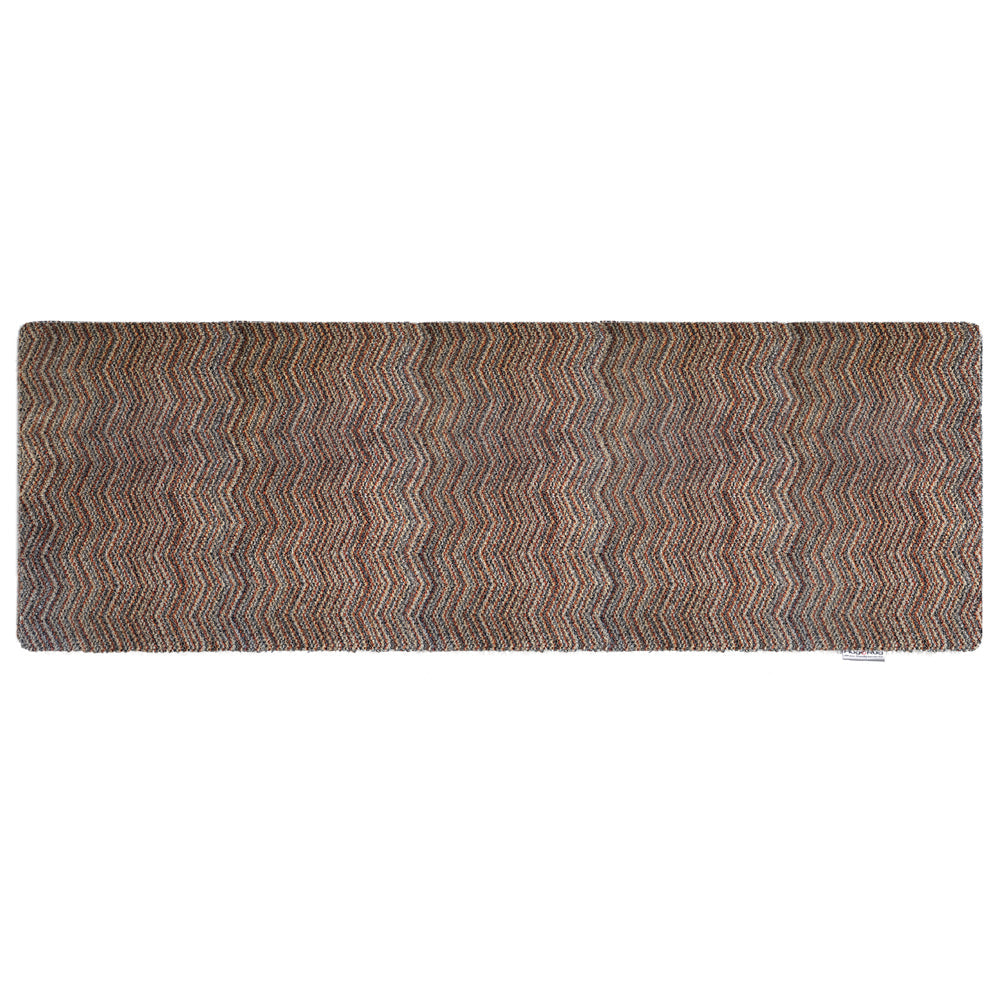 Candy Zig Zag Washable Runner- a 100% recycled material runner featuring a subtle zig-zag pattern in shades of red, beige, and navy, with a touch of white.