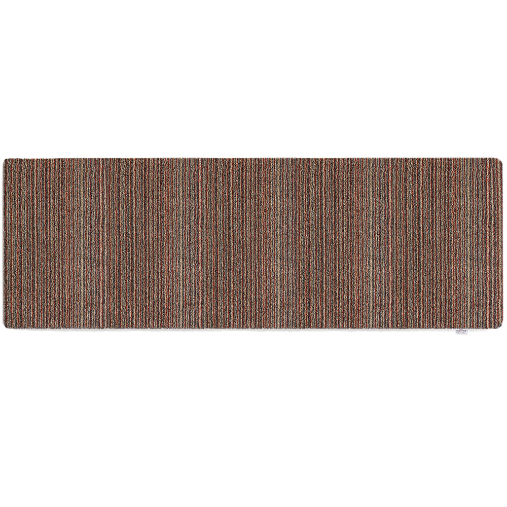 Candy Stripe Washable Runner- a 100% recycled material runner featuring a subtle striped pattern in shades of orange, red, beige, and grey.
