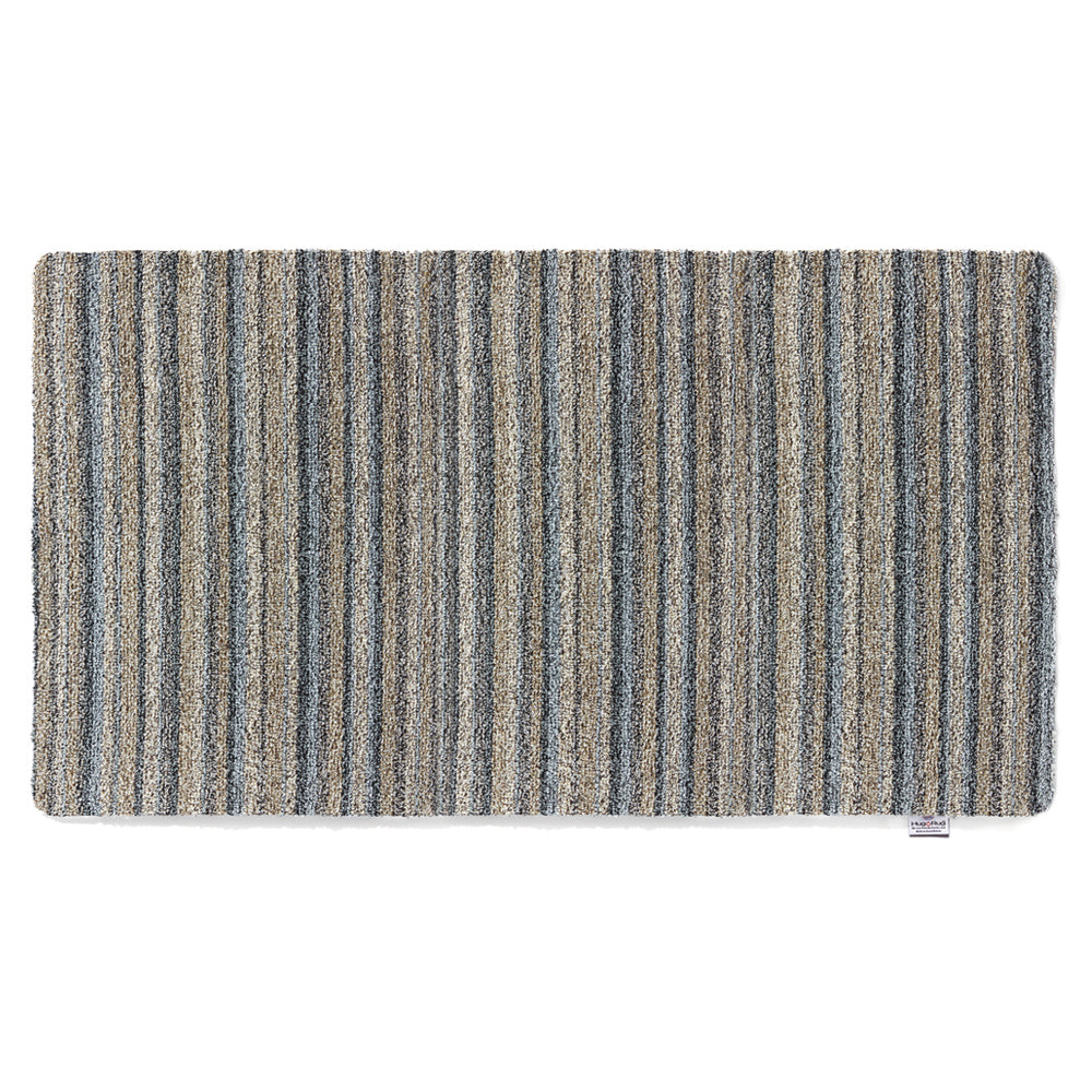 Ribbon Grey Striped Washable Runner- a 100% recycled material runner featuring a subtle striped pattern in shades of beige, light brown, and blue.
