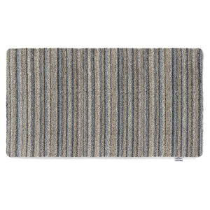 Ribbon Grey Striped Washable Runner- a 100% recycled material runner featuring a subtle striped pattern in shades of beige, light brown, and blue.