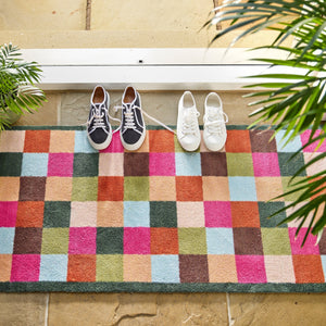 Allsorts Check Washable Runner- a 100% recycled cotton runner featuring multicoloured square checks in pink, beige, green, blue, orange, and brown.