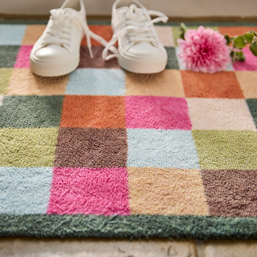 Allsorts Check Washable Runner- a 100% recycled cotton runner featuring multicoloured square checks in pink, beige, green, blue, orange, and brown.
