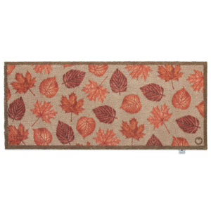Autumn Leaves Washable Runner in Beige- a 100% recycled cotton runner featuring hand-painted leaves in various shades of orange, red, and brown.