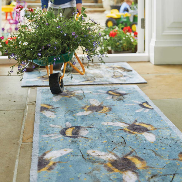 Bee 3 Charity Runner in Blue- 100% recycled cotton runner featuring yellow and charcoal splatters, with multi-directional bumblebees. Bee 3 Charity Washable Doormat 4