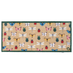 Bugs & Butterflies Beige Washable Runner in Beige- a 100% recycled cotton runner featuring a horizontal row of insects including butterflies, dragonflies, ladybugs, and beetles, in shades of blue, red, green, yellow, and white.