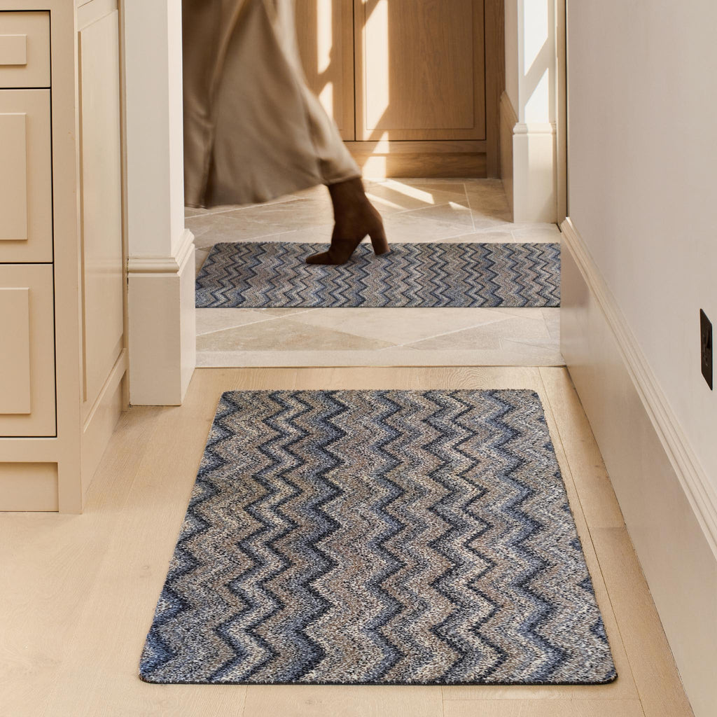 Ribbon Grey Zig Zag Washable Runner- a 100% recycled material runner featuring a subtle zig-zag pattern in shades of navy, blue, white, and beige.