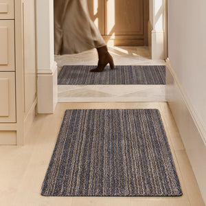 Candy Slate Striped Washable Runner- a 100% recycled material runner featuring a subtle striped pattern in shades of grey, beige, and brown.