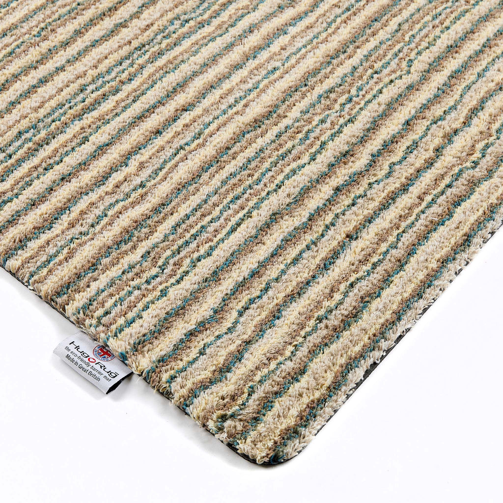 Candy Earth Stripe Washable Runner- a 100% recycled material runner in shades of blue, beige, brown, and light grey.