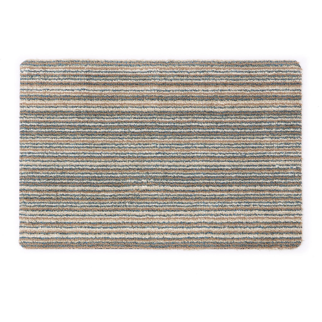 Candy Sand Stripe Washable Doormat- a recycled material doormat with a fleck design in the shades of teal, beige, brown, white, and light grey.