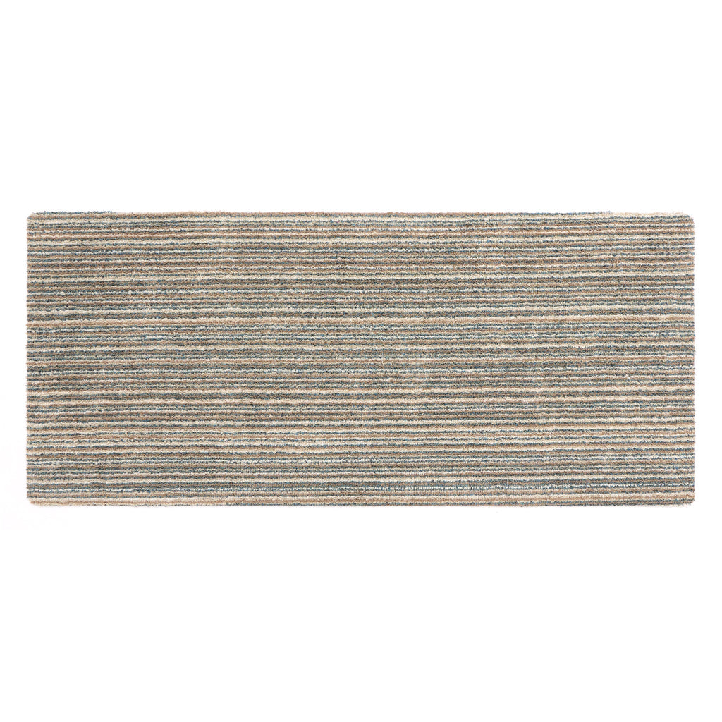 Candy Sand Striped Washable Runner- a 100% recycled material runner featuring a subtle striped pattern in shades of teal, beige, brown, white, and light grey.