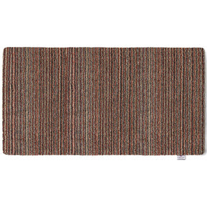 Candy Stripe Washable Runner- a 100% recycled material runner featuring a subtle striped pattern in shades of orange, red, beige, and grey.