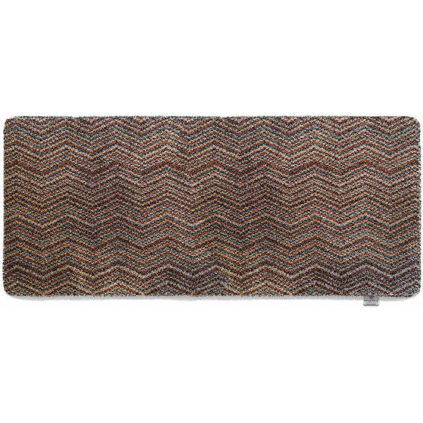 Candy Zig Zag Washable Runner- a 100% recycled material runner featuring a subtle zig-zag pattern in shades of red, beige, and navy, with a touch of white.