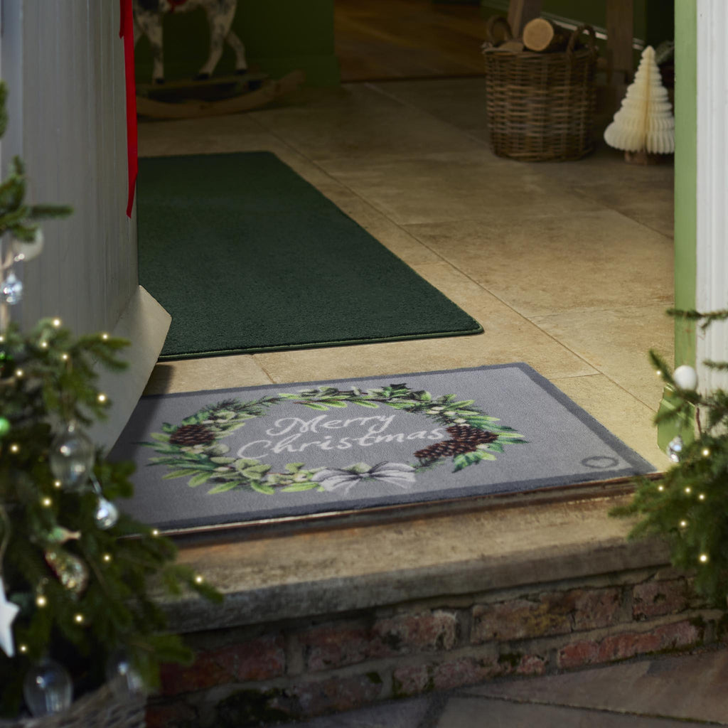 Christmas Wreath Doormat- a cotton doormat featuring a wreath and graphic font.