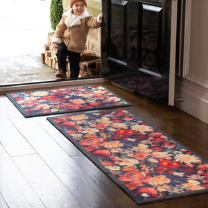 Dark Florals Washable Runner- a 100% recycled cotton runner featuring oversized floral blooms in shades of red, cream, orange, and pink against a navy backdrop.