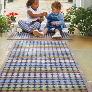 Designer 22 Washable Runner- a 100% cotton runner featuring vertical rows of rainbow-coloured spots.