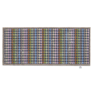 Designer 22 Washable Runner- a 100% cotton runner featuring vertical rows of rainbow-coloured spots.