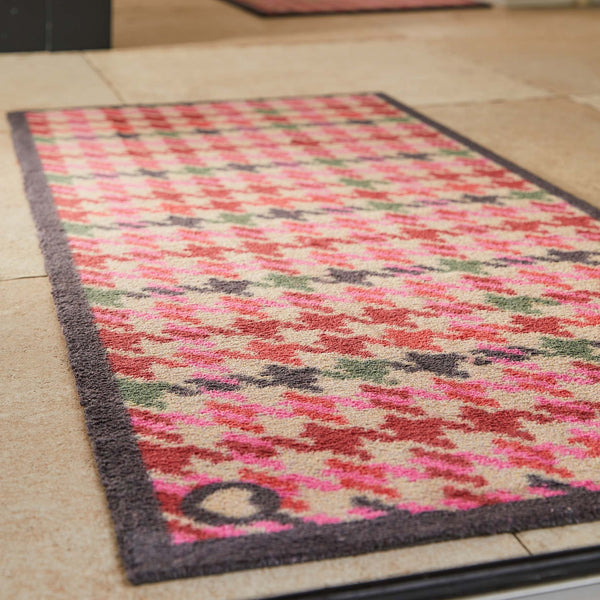 Designer 27 Washable Runner- a 100% cotton runner featuring a vertical houndstooth pattern in shades of pink, red, green, and dark navy
