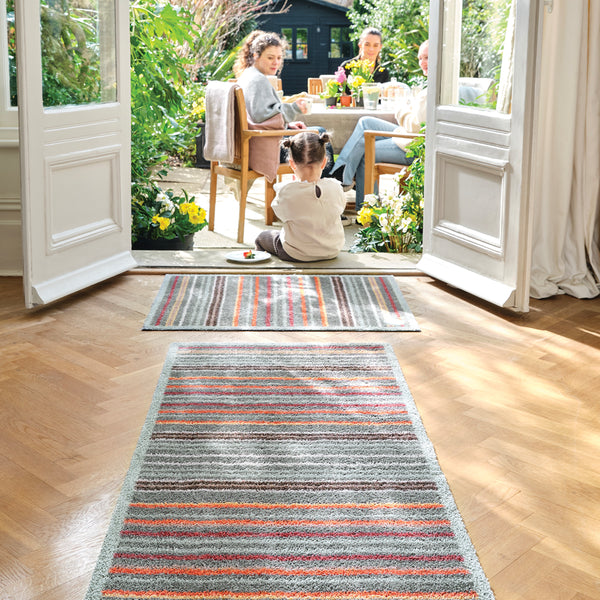 Designer 13 Washable Runner in Grey- a 100% recycled cotton runner featuring bright multicoloured vertical stripes.