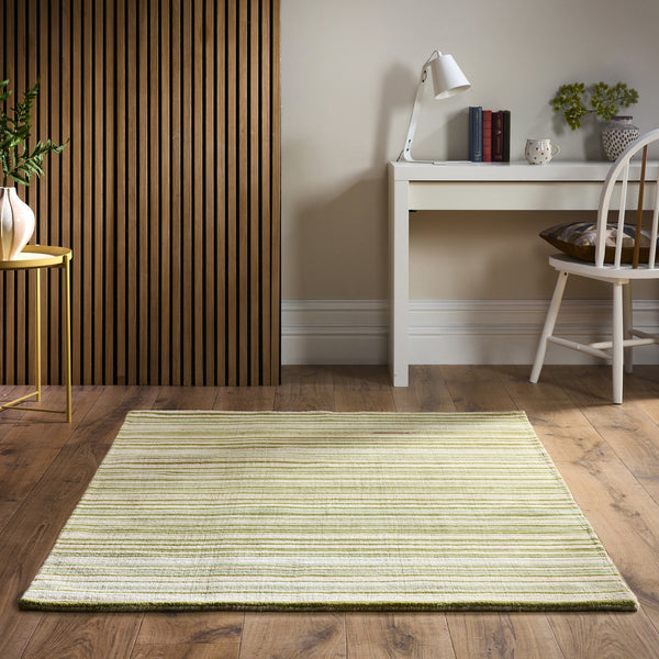 Green Fine Stripe Rug- 100% wool cut pile in green with a striped pattern.
