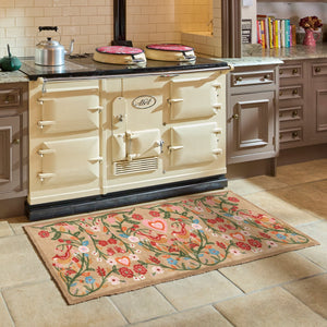 Garden Lovebirds Washable Runner- a 100% recycled cotton doormat featuring two lovebirds in shades of red, yellow, light pink, and cream, surrounded by floral vines.