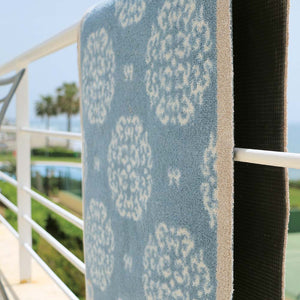 Home 15 Blue Washable Runner in Blue - a 100% recycled cotton runner featuring a delicate white floral pattern.