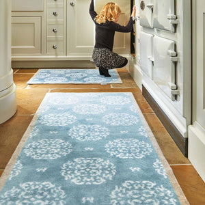 Home 15 Blue Washable Runner in Blue - a 100% recycled cotton runner featuring a delicate white floral pattern.