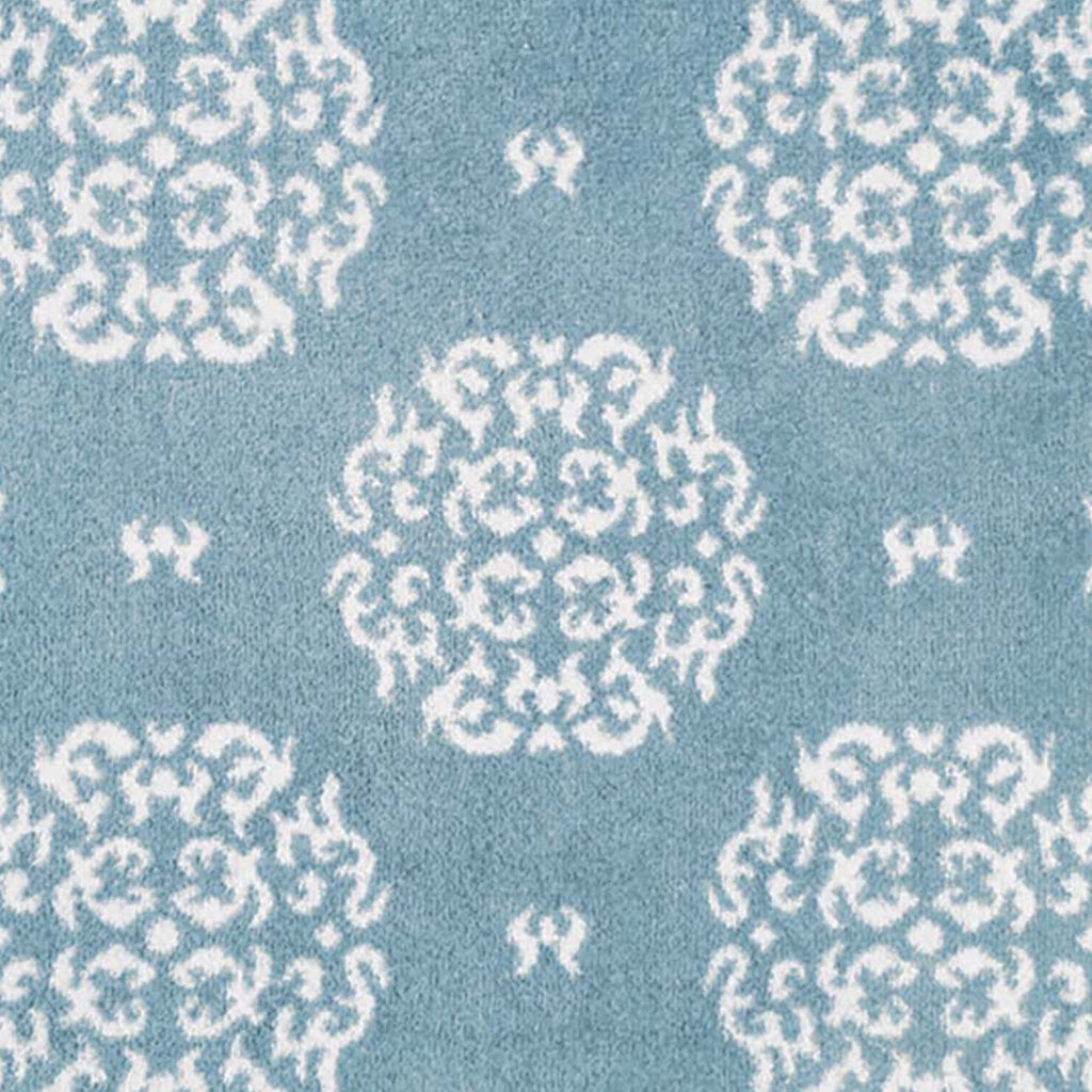 Home 15 Blue Washable Runner in Blue - a 100% recycled cotton runner featuring a delicate white floral pattern.