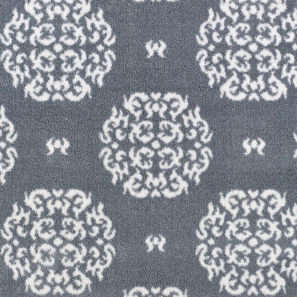 Home 44 Washable Runner in Grey- a 100% recycled cotton runner featuring a horizontal array of white floral patterns.