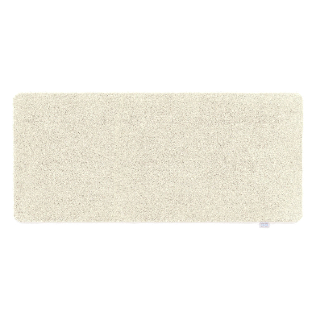 Pumice Stone Washable Runner- a 100% recycled polyester runner in a solid cream colour.