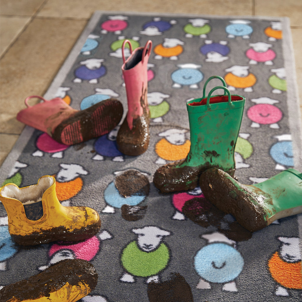 Discover the Marra Grey Herdy Washable Runner- a 100% recycled cotton runner featuring an all-over colourful print of Herdy's in pink, green, orange, blue, and purple. Soft, durable, and perfect for hallways, kitchens, entryways and in front of patio doors.