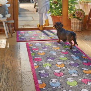 Marra Pink Herdy Washable Runner in charcoal- a 100% recycled cotton runner featuring colourful print of Herdy's in pink, green, orange, blue, and purple.