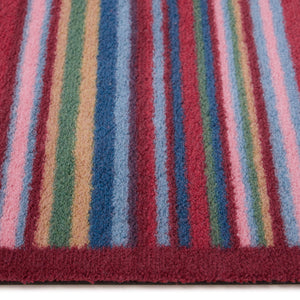 Multi Stripe Red Washable Runner- a 100% recycled cotton runner featuring vibrant stripes in pink, light blue, dark blue, grey, orange, and dark brown.