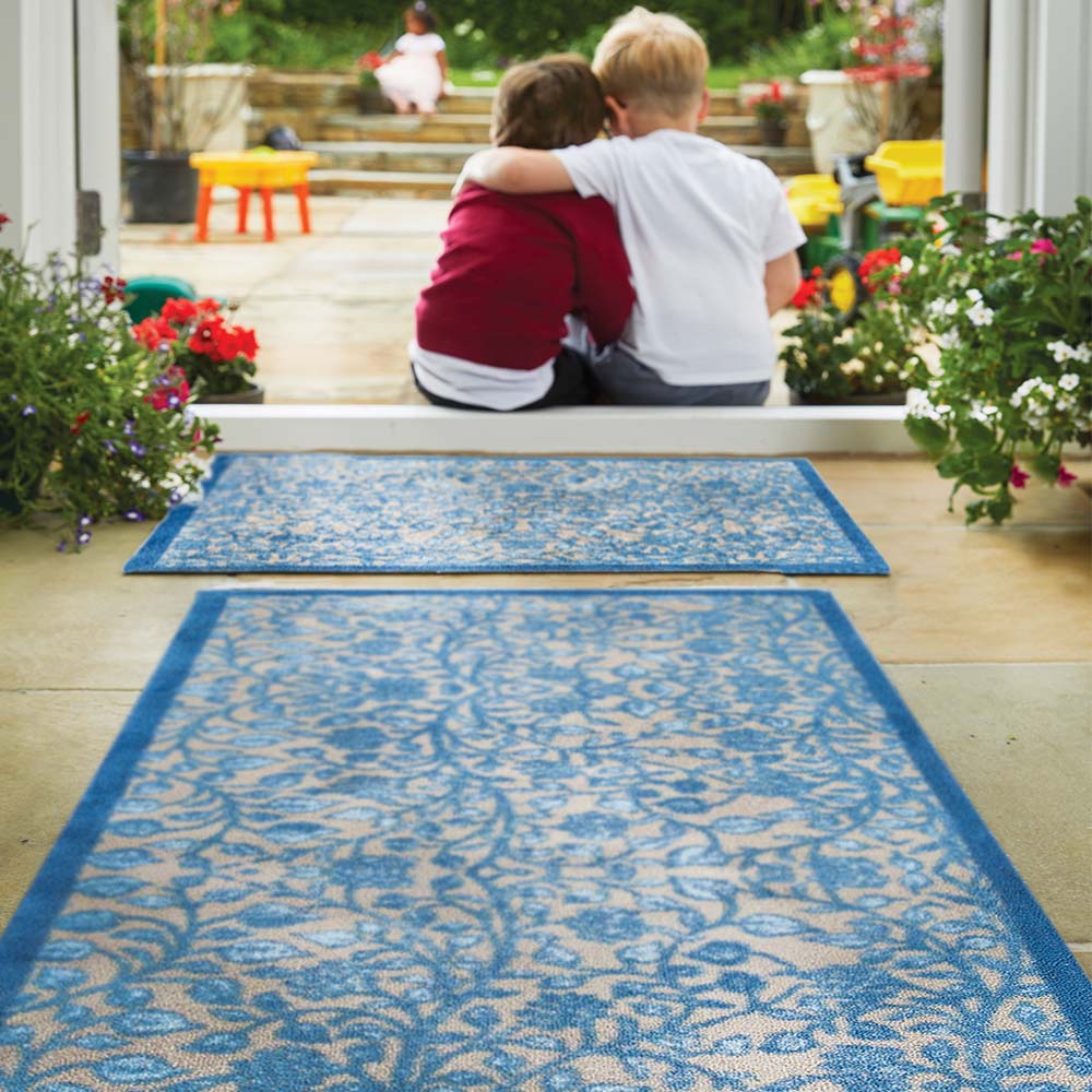 Nature 33 Washable Runner in Beige- a 100% recycled cotton runner featuring intertwining floral pattern in various shades of blue.
