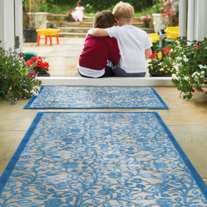 Nature 33 Washable Runner in Beige- a 100% recycled cotton runner featuring intertwining floral pattern in various shades of blue.