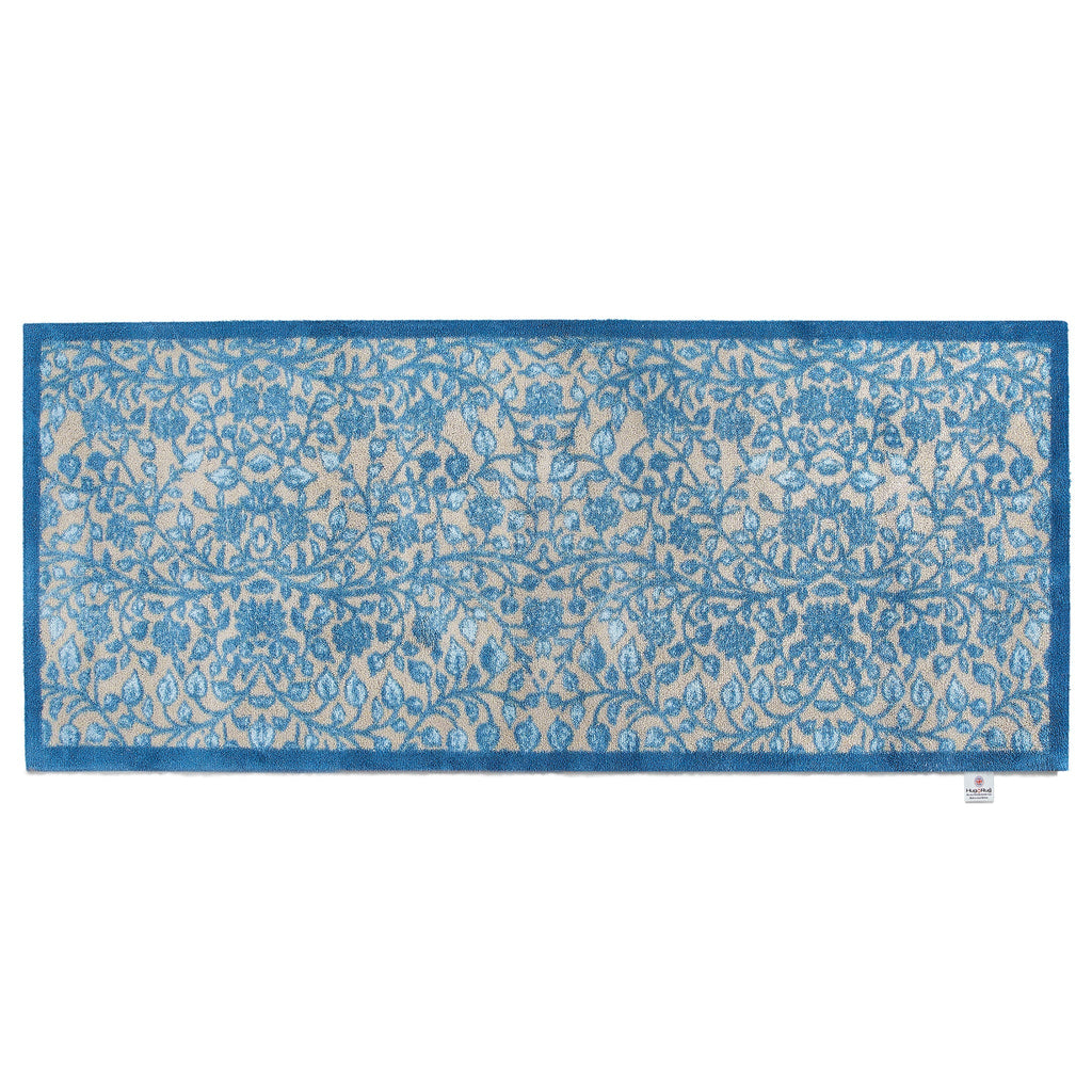 Nature 33 Washable Runner in Beige- a 100% recycled cotton runner featuring intertwining floral pattern in various shades of blue.