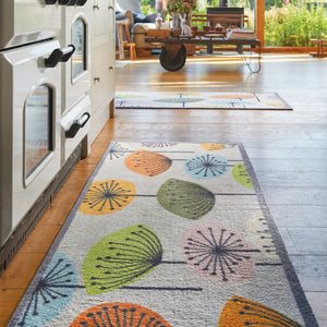 Nature 40 Washable Runner in Grey- a 100% recycled cotton runner featuring dandelions in blue, orange, green, khaki, pink, and cream.