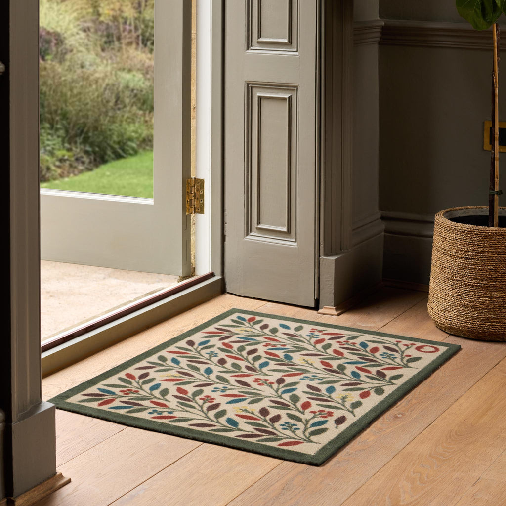 Olive Branch Washable Doormat- a cotton mat featuring multicoloured branches and olives.