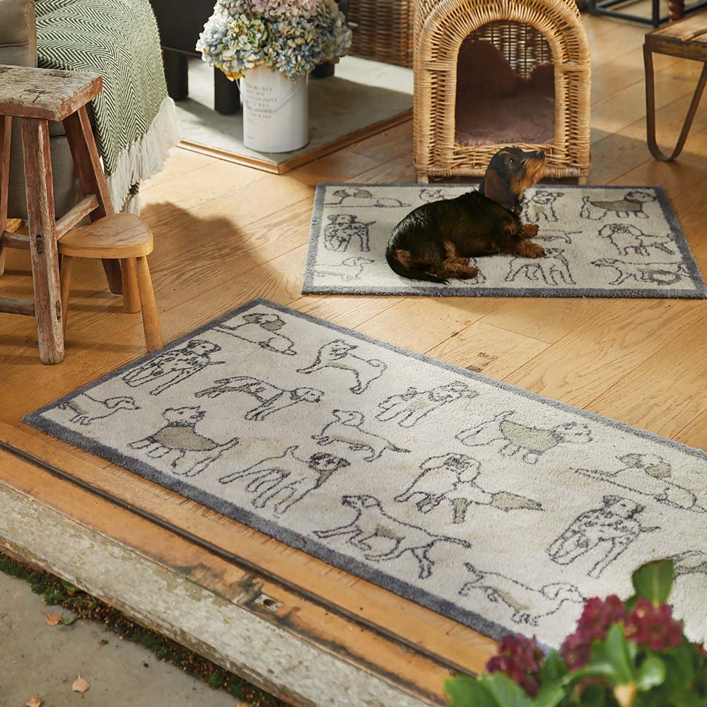 Pet 70 Dogs Grey Washable Runner- a 100% recycled cotton runner featuring navy outlines of different dog breeds, accented with brown colouring.
