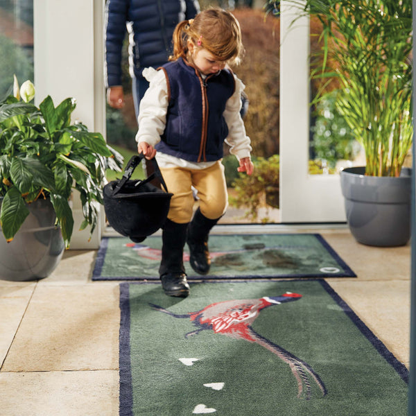 Pheasant Green 2 Washable Runner in green- a 100% recycled cotton runner featuring a pheasant facing left with a trail of white hearts.