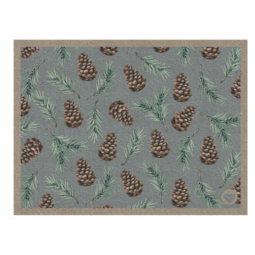 Pinecones Washable Doormat- a cotton doormat featuring scattered brown pinecones and green fern leaves.
