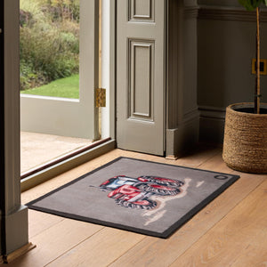 Red Farmyard Tractor Washable Doormat- a cotton washable doormat featuring a red tractor splashing through mud.