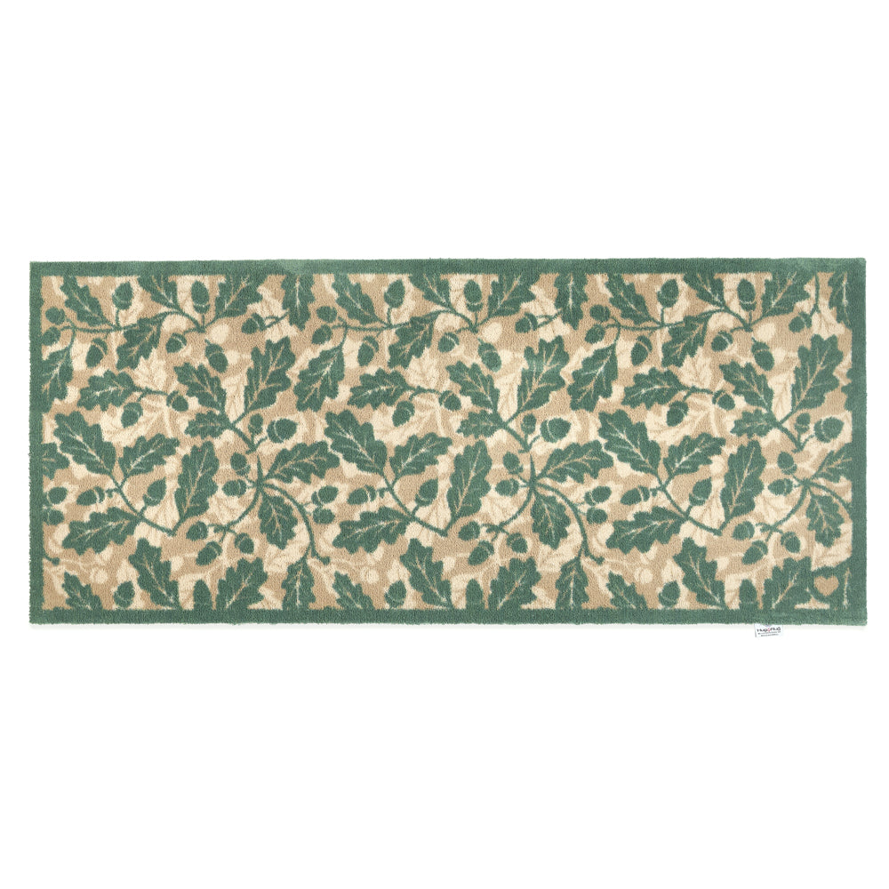 Discover the Royal Oak Washable Runner- a 100% recycled cotton runner featuring pattern of green oak leaves.