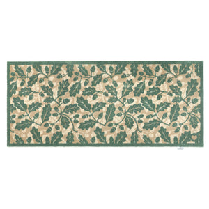 Discover the Royal Oak Washable Runner- a 100% recycled cotton runner featuring pattern of green oak leaves.