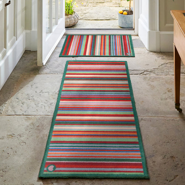 Bright Green Stripe Washable Runner- a 100% recycled cotton runner featuring a bright striped design in green, red, orange, and blue.