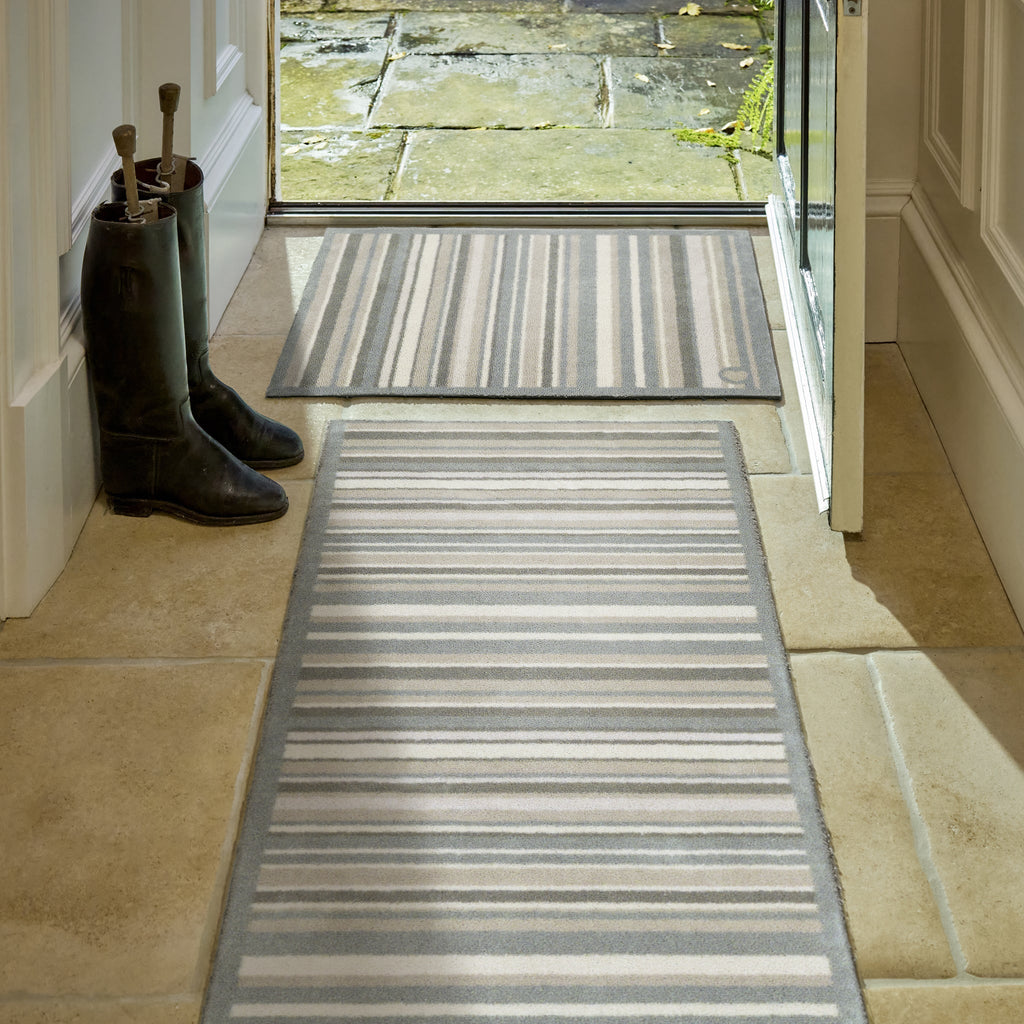 Sage Stripe Washable Doormat- a 100% recycled cotton doormat featuring a muted striped design.