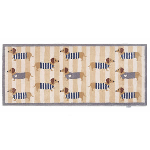 Sausage Dog Chic Washable Runner- 100% recycled cotton runner featuring sausage dogs in jumpers against a beige and cream striped background.