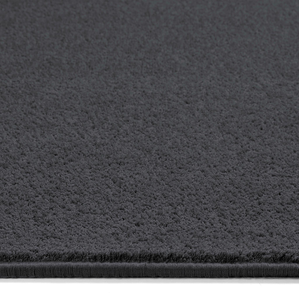 Sense Charcoal Washable Rug Runner- a 100% recycled polyester rug runner in a dark grey.