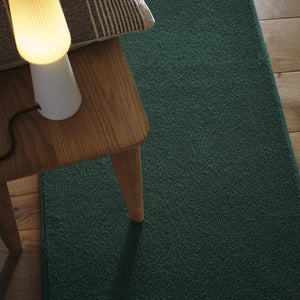 Sense Forest Green Washable Rug Runner- a 100% recycled polyester rug runner in a solid green colour.